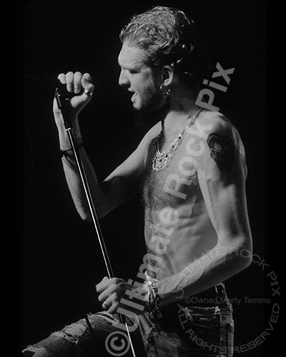 Black and white photo of Layne Staley of Alice in Chains onstage in 1991 in Hollywood, California by Marty Temme