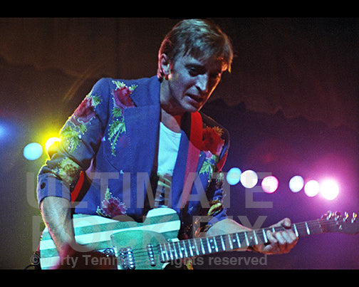 Photo of Mick Ronson of Ian Hunter and David Bowie playing a Telecaster in 1981 by Marty Temme