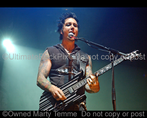 Photo of guitar player Synyster Gates of Avenged Sevenfold in concert by Marty Temme