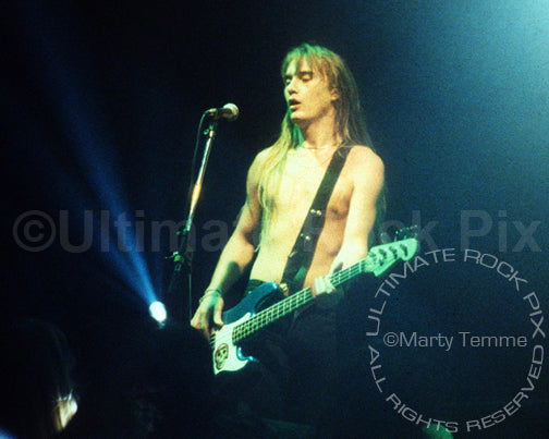 Photo of bassist Lonnie Vencent of BulletBoys in concert in 1989 by Marty Temme