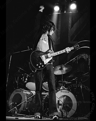 Black and white photo of Jeff Beck playing his Oxblood Les Paul in concert in 1973 by Marty Temme