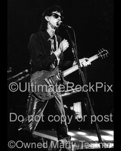 Photo of Ric Ocasek of The Cars in concert in 1978 by Marty Temme
