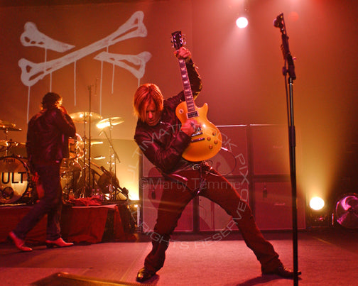 Photo of Billy Duffy of The Cult playing a Gibson Goldtop in concert by Marty Temme