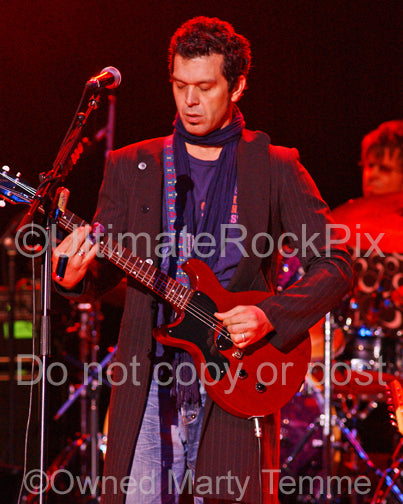 Photo of Doyle Bramhall II playing a left-handed Les Paul Junior in concert by Marty Temme