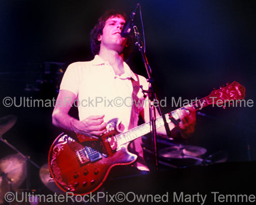Photo of Bob Weir of The Grateful Dead playing an Ibanez guitar in 1983 by Marty Temme