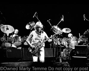 Photo of Phil Collins, Mike Rutherford and Chester Thompson of Genesis in 1978 by Marty Temme