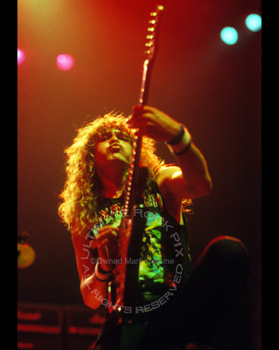 Photo of Janick Gers of Iron Maiden in concert in 1991 by Marty Temme