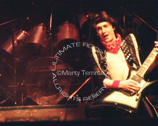 Photo of Adrian Smith of Iron Maiden in concert in 1985 by Marty Temme