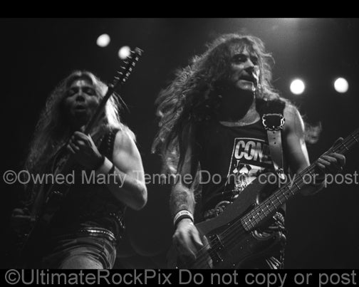 Photo of Dave Murray and Steve Harris of Iron Maiden in concert in 1991 by Marty Temme