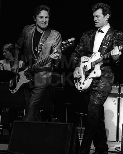 Photo of Chris Isaak and Rowland Salley in concert