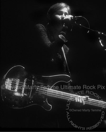 Black and white photo of bass player Kira Roessler of Black Flag in concert in 1995 by Marty Temme