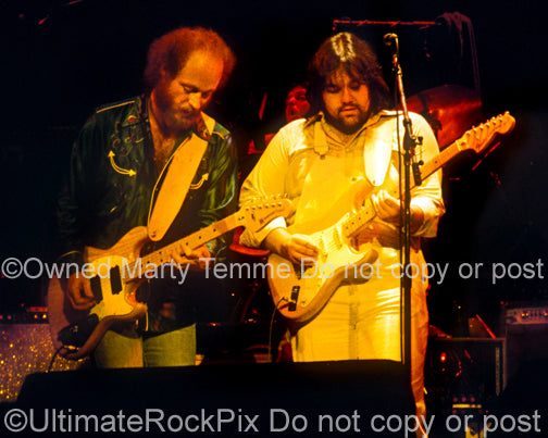Photo of Lowell George and Paul Barrere of Little Feat onstage in 1978 by Marty Temme