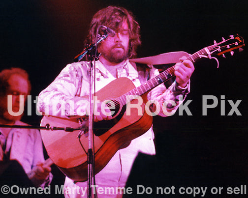 Photo of Lowell George of Little Feat playing a Gibson acoustic in concert in 1977 by Marty Temme