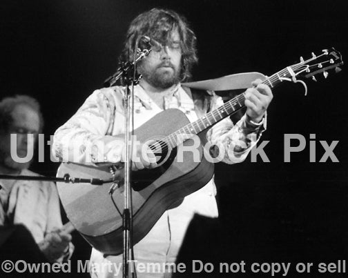 Black and white photo of Lowell George of Little Feat playing a Gibson acoustic in 1977 by Marty Temme