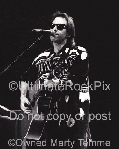 Photo of musician Nils Lofgren in concert in 1991 by Marty Temme