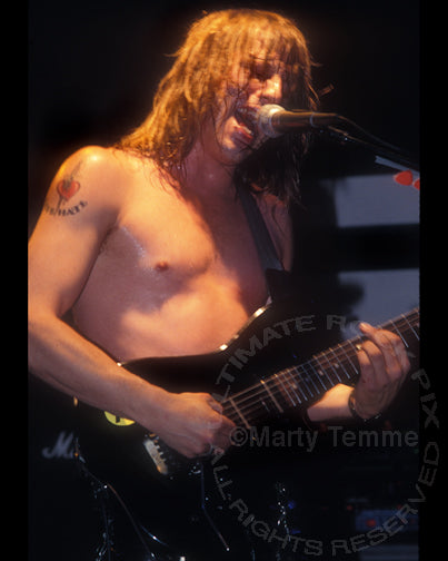Photo of Jon E. Love of the band Love/Hate in concert in 1990 by Marty Temme