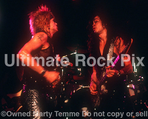 Photo of Michael Monroe performing in concert in 1989 by Marty Temme