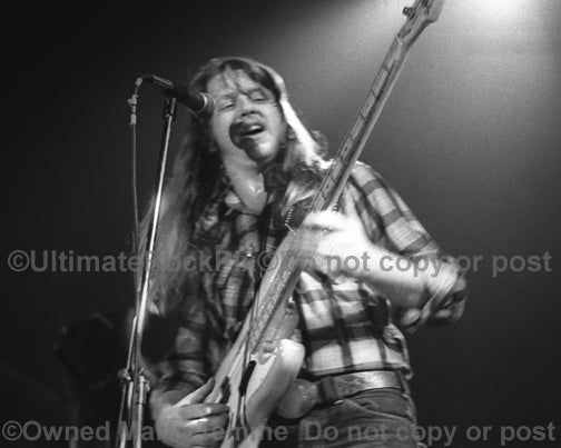 Photo of bassist Tommy Caldwell of The Marshall Tucker Band in concert in 1974 by Marty Temme