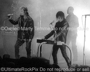 Photo of Trent Reznor of Nine Inch Nails and David Bowie in concert in 1995 by Marty Temme