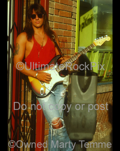 Photo of Richie Sambora of Bon Jovi with a Stratocaster in 1991 by Marty Temme