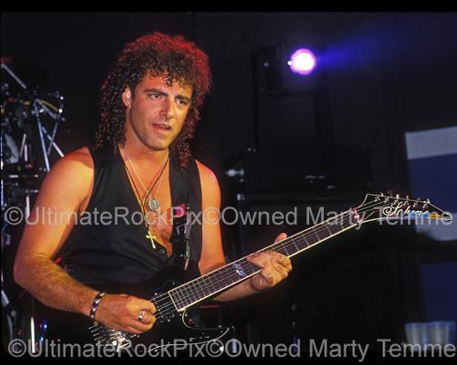 Photo of Neal Schon of Bad English playing guitar onstage at The Whisky in 1989 by Marty Temme