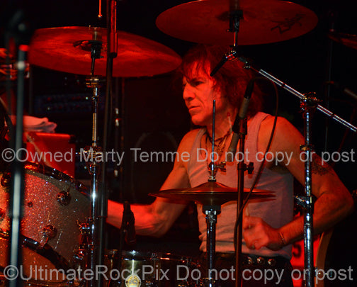 Photo of Sandy Gennaro of Pat Travers in concert in 2009 by Marty Temme