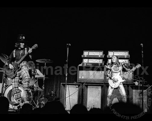 Photo of Noddy Holder and Dave Hill of Slade in concert in 1973 by Marty Temme