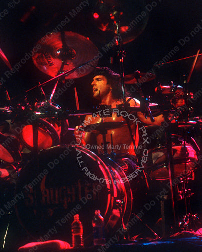 Photo of drummer Bobby Rock of Slaughter in concert in 2003 by Marty Temme