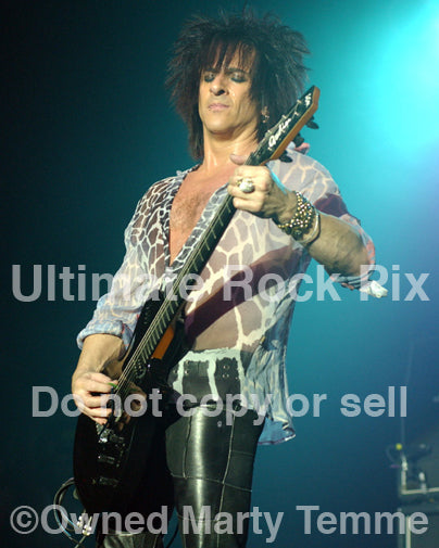 Photo of guitar player Steve Stevens of Billy Idol in concert in 2005 by Marty Temme