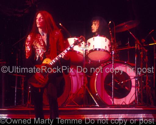 Photos of Scott Gorham and Brian Downey of Thin Lizzy in Concert in 1977 by Marty Temme
