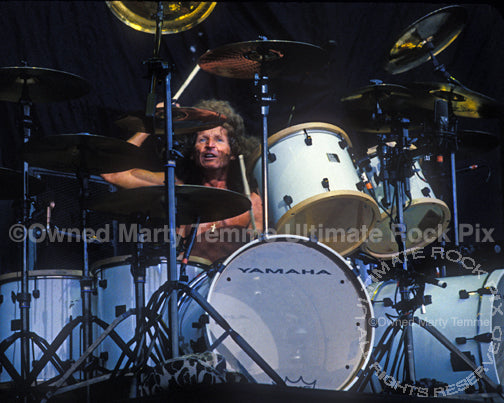 Photo of drummer Tommy Aldridge performing in concert by Marty Temme