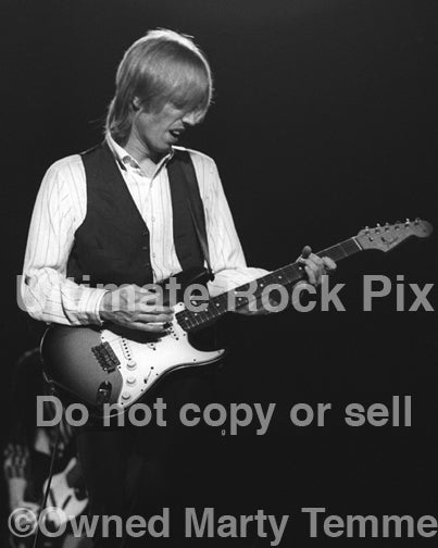 Black and white photo of Tom Petty in concert in 1980 by Marty Temme