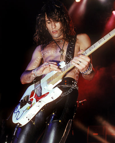 Photo of guitarist Erik Turner of Warrant in concert in 1989 by Marty Temme