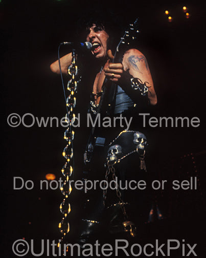 Photo of Randy Piper of W.A.S.P. in concert in 1986 by Marty Temme