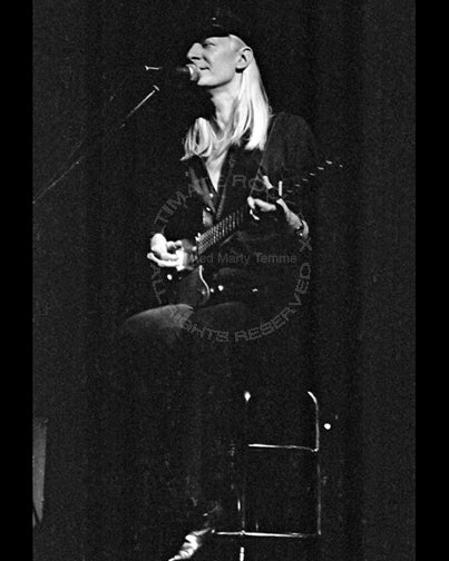 Black and white photo of Johnny Winter in concert in 1979 by Marty Temme