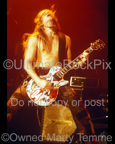 Photo of guitarist Zakk Wylde of Ozzy Osbourne playing a Gibson Les Paul in concert in 1991 by Marty Temme