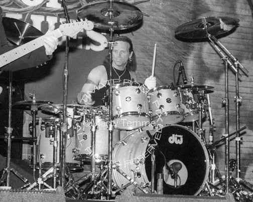 Photo of Joey Kramer of Aerosmith in concert in 1994 by Marty Temme