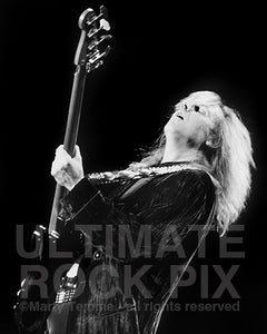 Black and white photo of bass player Tom Hamilton in concert by Marty Temme