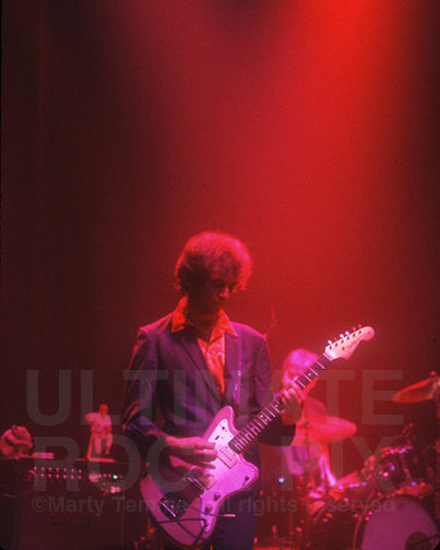 Photo of Rick McCollum of The Afghan Whigs playing a Fender Jazzmaster in concert in 1996 by Marty Temme