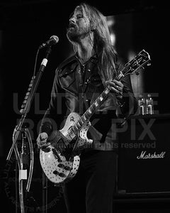 Black and white photo of Jerry Cantrell of Alice in Chains playing a Les Paul in concert in 2006 by Marty Temme