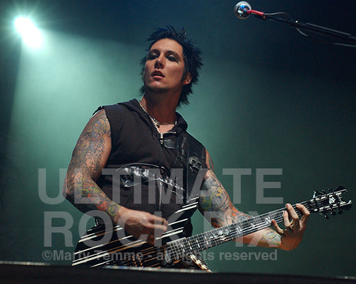 Photo of guitar player Synyster Gates of Avenged Sevenfold in concert by Marty Temme