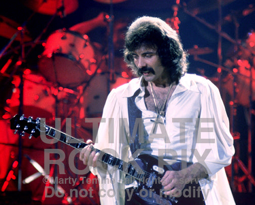 Photo of Tony Iommi of Black Sabbath in concert in 1978 by Marty Temme