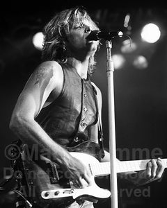 Black and white photo of Jon Bon Jovi in concert in 1992 by Marty Temme