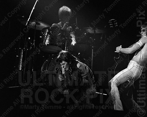 Black and white photo of David Bowie and Mick Ronson onstage in 1973 by Marty Temme