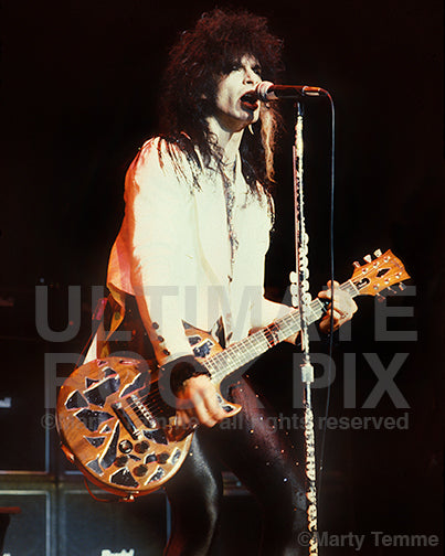 Photo of Dean Davidson of Britny Fox singing and playing guitar in concert in 1989 by Marty Temme