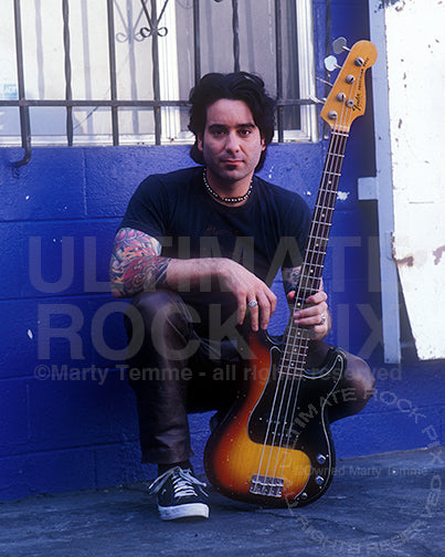 Photo of bassist Jonathan Brightman of Buckcherry during a photo shoot in 2001 by Marty Temme