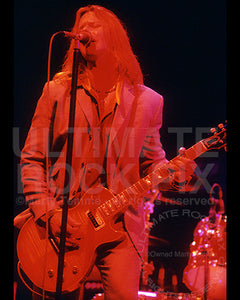 Photo of Robert Mason of Cry of Love playing a Les Paul in concert in 1997 by Marty Temme