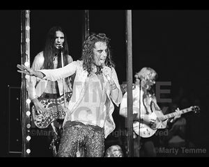 Photo of Alice Cooper, Dennis Dunaway and Glen Buxton onstage in 1973 by Marty Temme