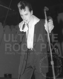 Photo of vocalist Dave Vanian of The Damned in concert in 1988 by Marty Temme