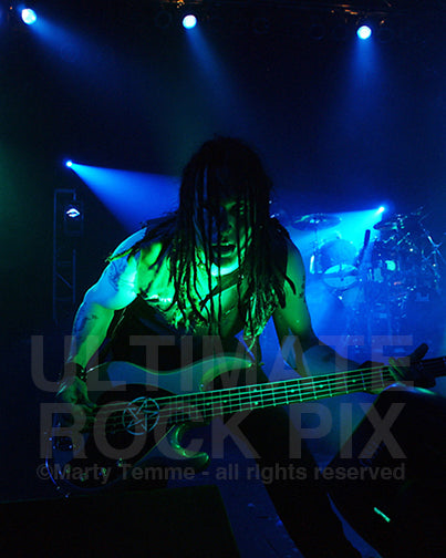 Photo of bass player John Moyer of Disturbed in concert by Marty Temme